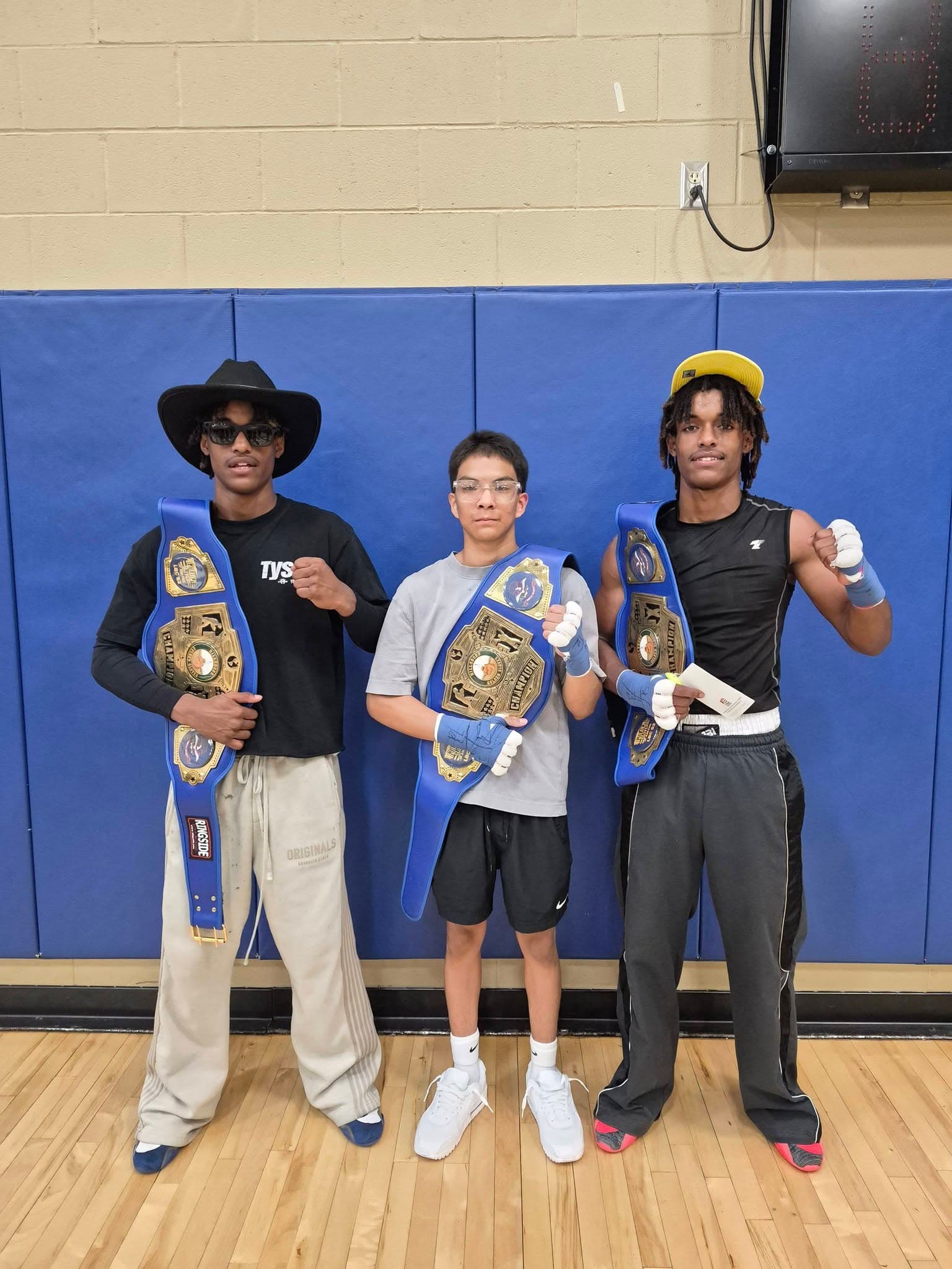 Vargas fighters with their championship belts
