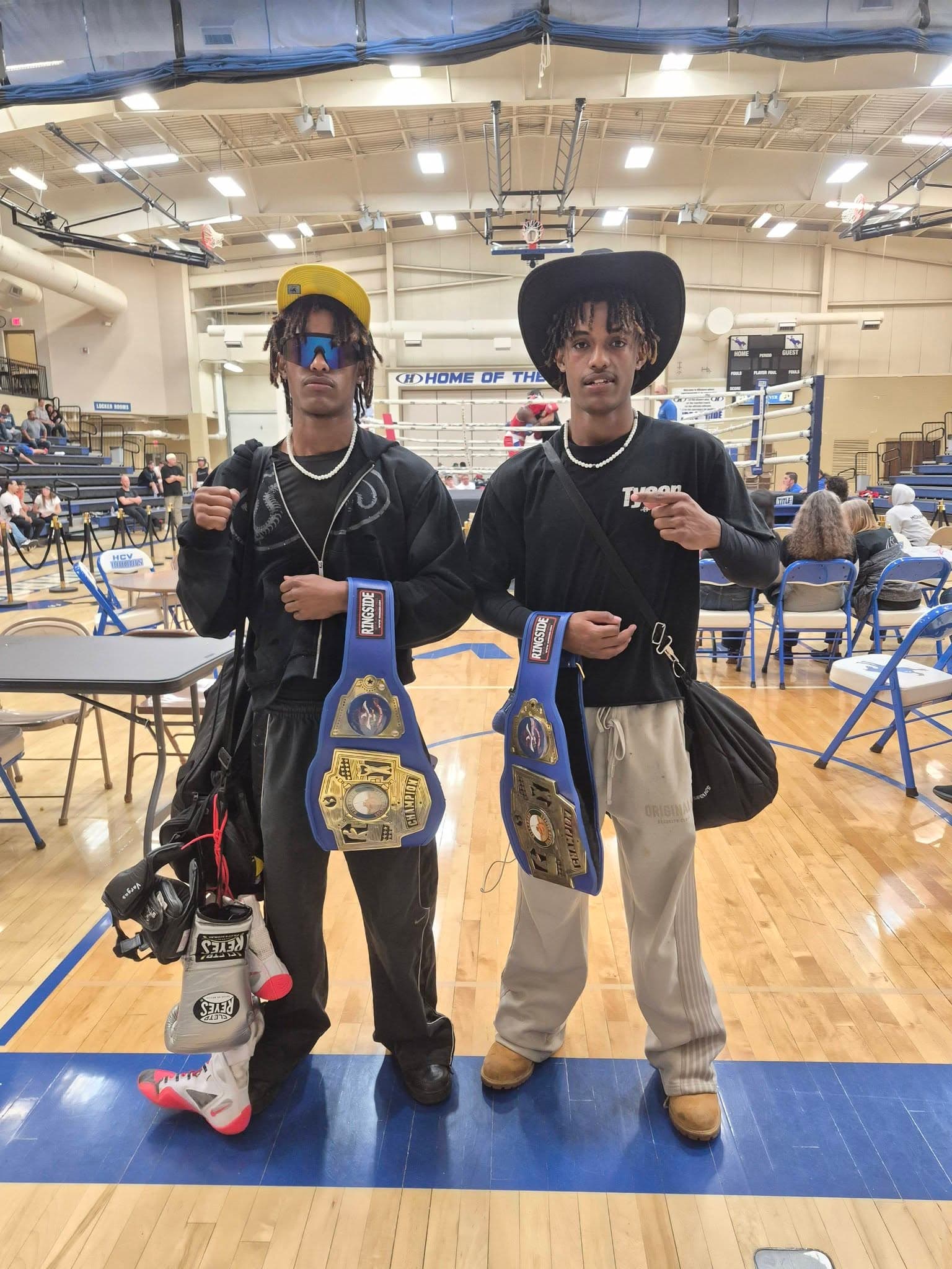 Vargas fighters holding their championship belts