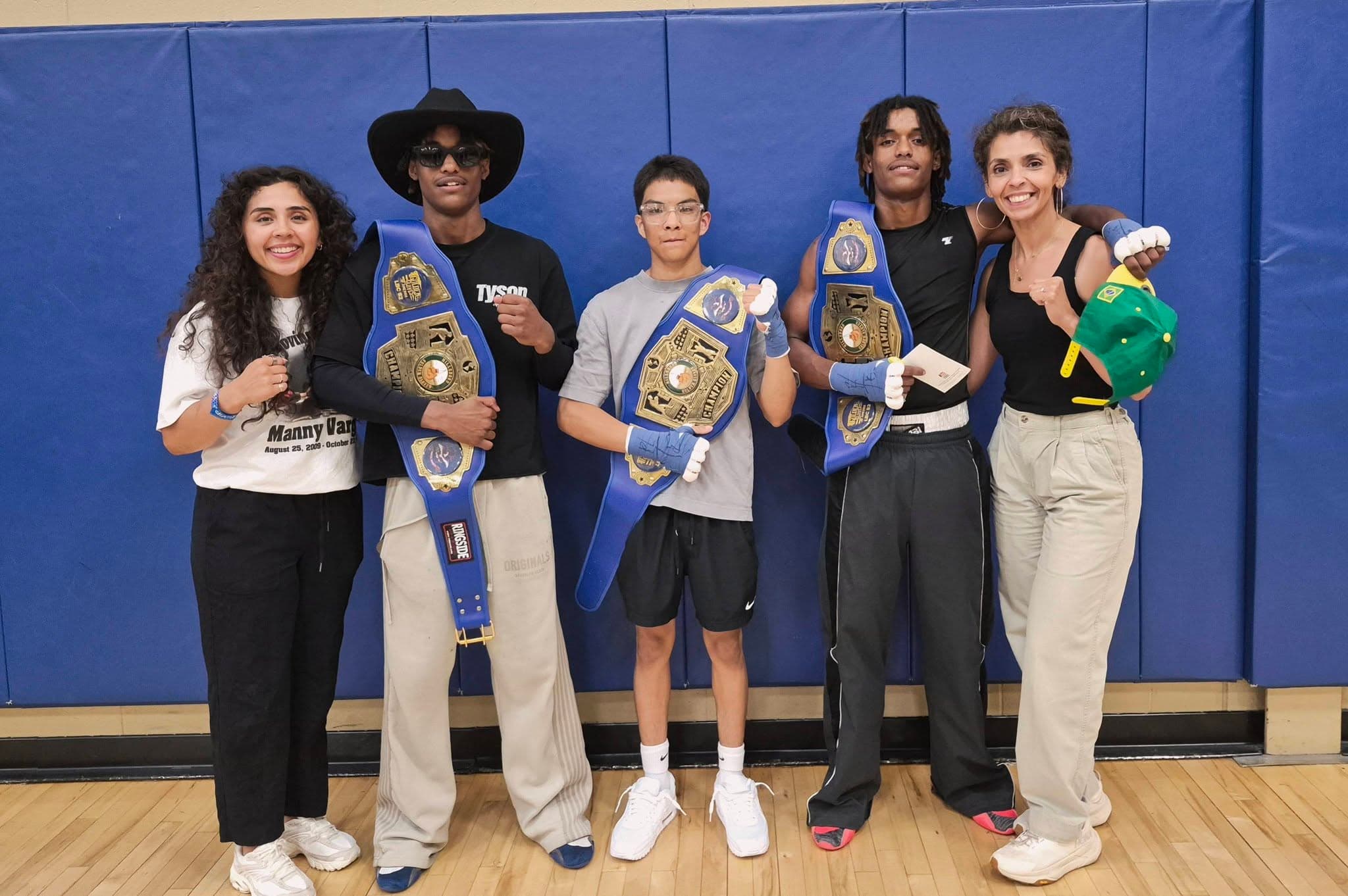 Young Vargas fighters with their championship belts