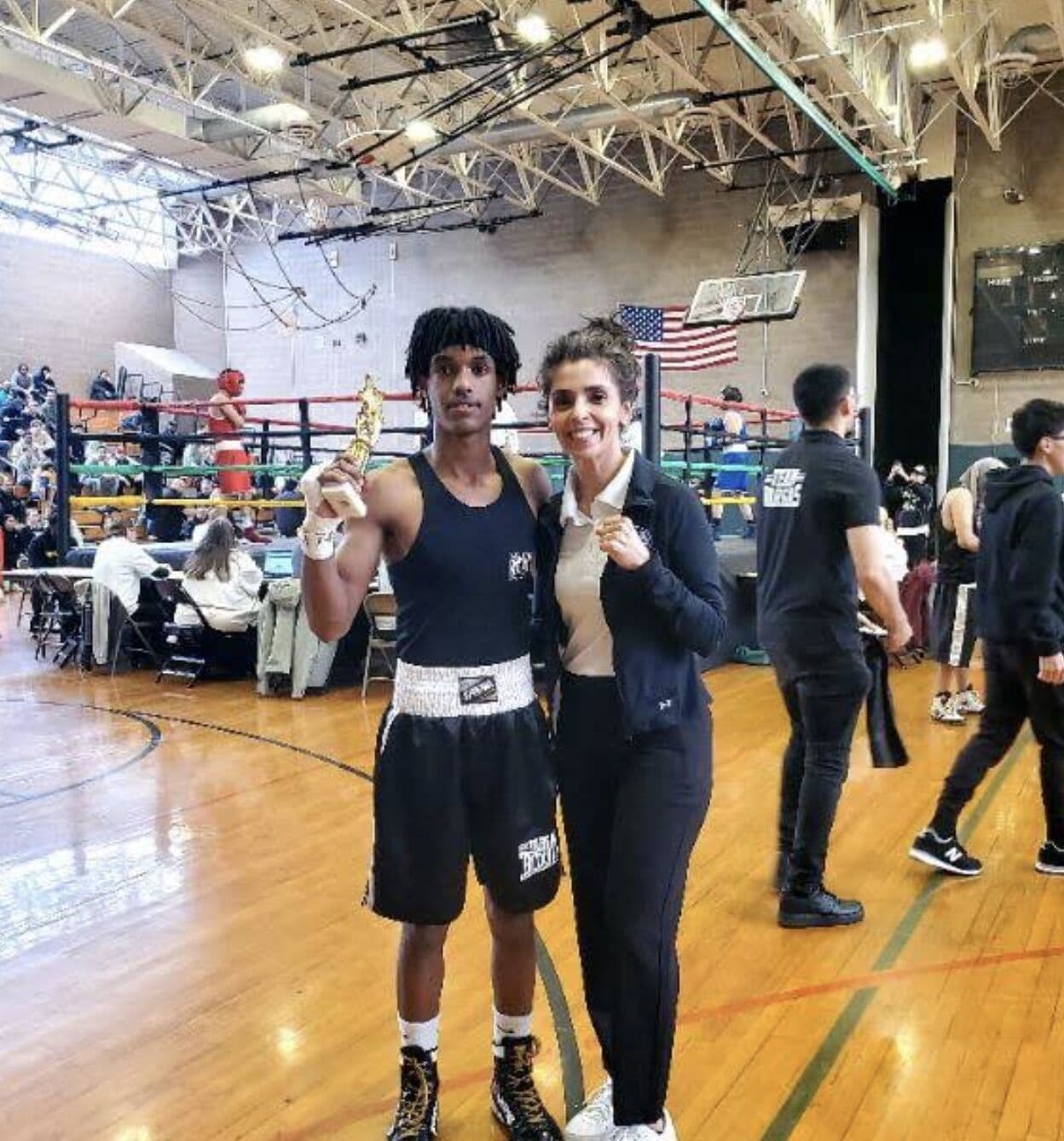 A young Vargas boxer with a tournament trophy
